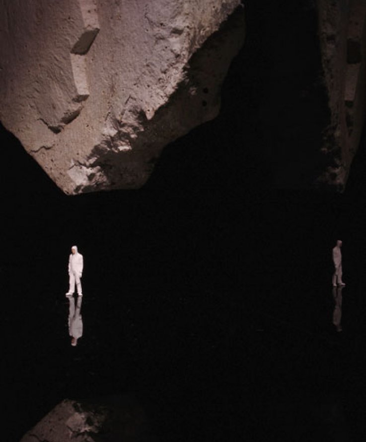 Nature Above, 2012, <br />
Black plexiglass, stone and miniature figure