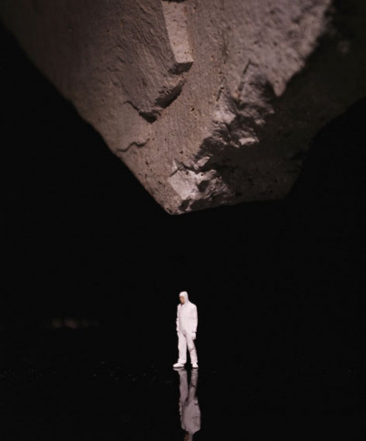 Nature Above, 2012, <br />
Black plexiglass, stone and miniature figure